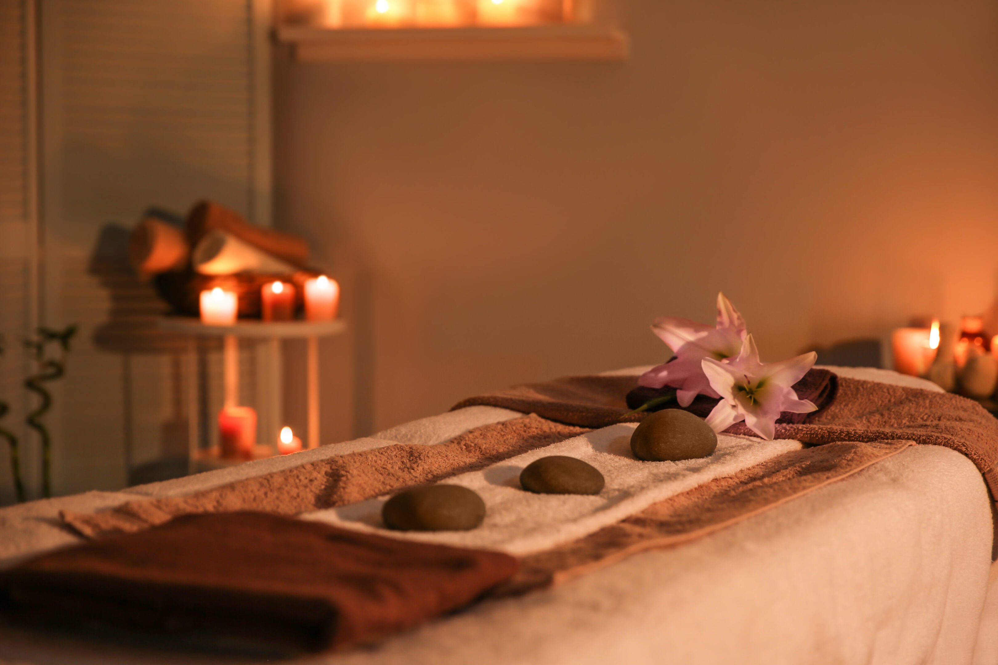 Interior of modern massage room in candle light